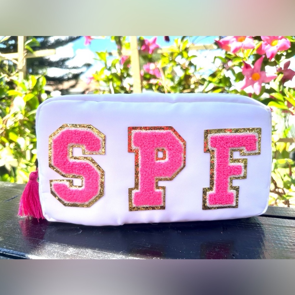 White Cosmetic Bag with Pink and Gold Letters